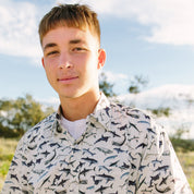 Shark Paradise Hawaiian shirt featuring bold shark graphics in blue and white, tropical festive style. | Tropicool Clothing