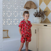 Gingerbread Jest Christmas kids shirt with festive gingerbread man pattern and holiday colors, short sleeves. | Tropicool Clothing