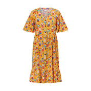 Knee-length button-up tropical Christmas dress with Nutcracker, Santa, and festive beach print. | Tropicool Clothing