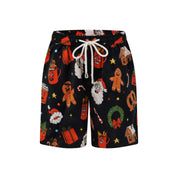 Black Christmas kids shorts with white drawstring, gingerbread men, Santa, and festive holiday icons. | Tropicool Clothing