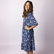 Side view of Tropicool Alice Reindeer Navy Christmas dress with flutter sleeves and navy reindeer print