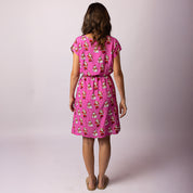 Back view of the Alice Santa Polka Pink Adult Dress featuring lightweight fabric and all-over Santa print – festive women’s Christmas outfit by Tropicool