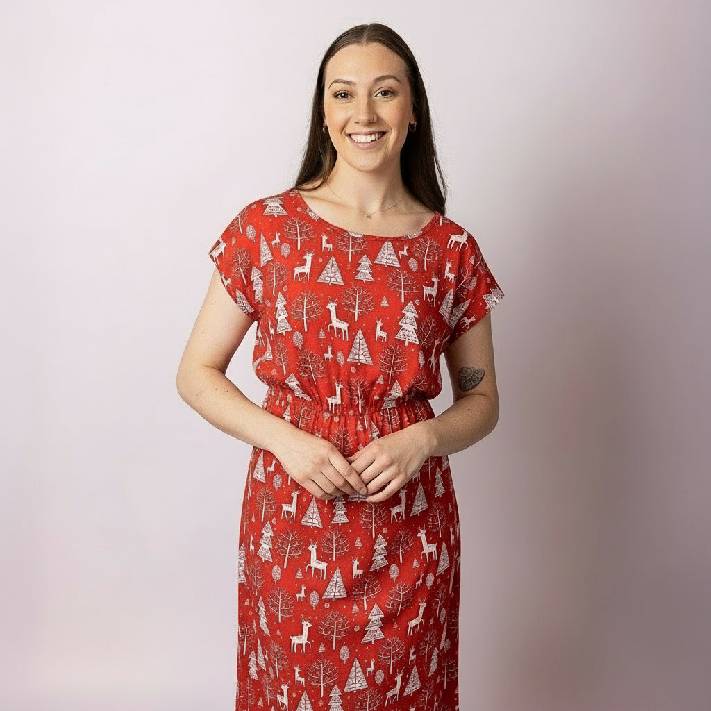Close-up of the Celyn Reindeer Red Adult Dress showing reindeer and Christmas tree print — breathable summer fabric, stylish festive outfit ideal for parties and family photos.
