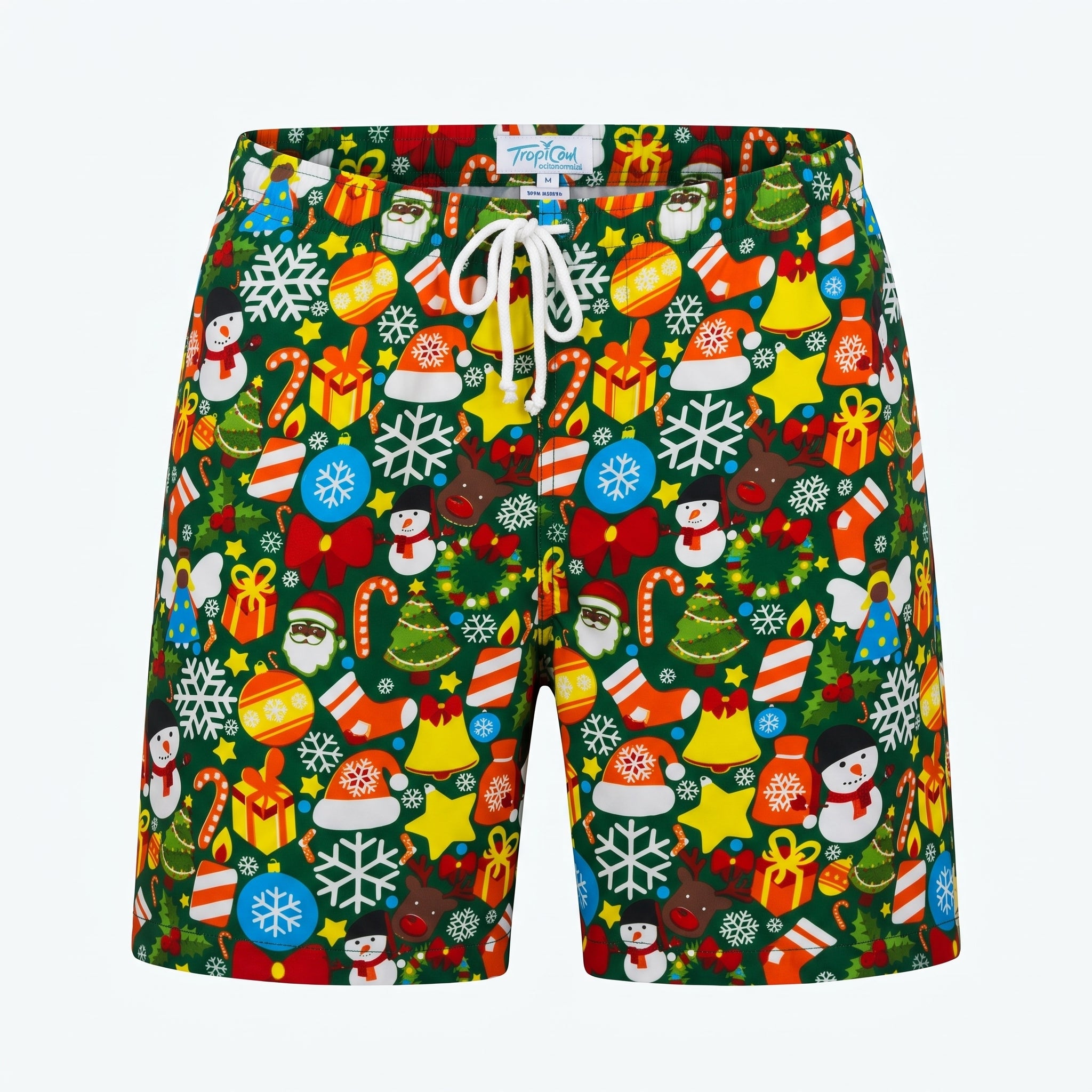 A pair of men's swim trunks by Tommy Hilfiger, featuring a vibrant Christmas-themed all-over print on a dark green background with white drawstrings. The print includes festive icons like snowflakes, Santa Claus, snowmen, Christmas trees, candy canes, ornaments, and gifts in red, yellow, blue, and white.