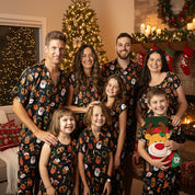 Family wearing matching Tropicool Jingleverse Christmas outfits, including the Holly Jingleverse Kids Dress, showing full family-matching styles.