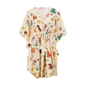 Cream kaftan dress for kids with festive dog print and drawstring waist, perfect for tropical holidays. | Tropicool Clothing